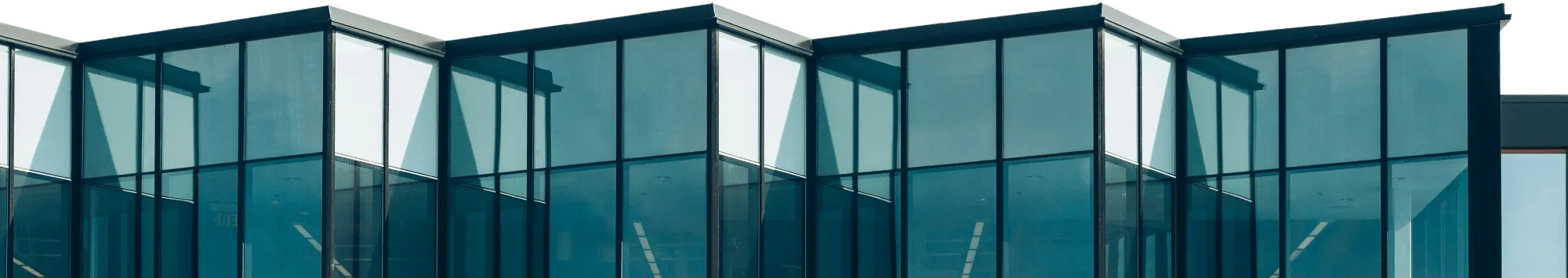 Sawtooth roofline of a glass-and-aluminium curtain wall
